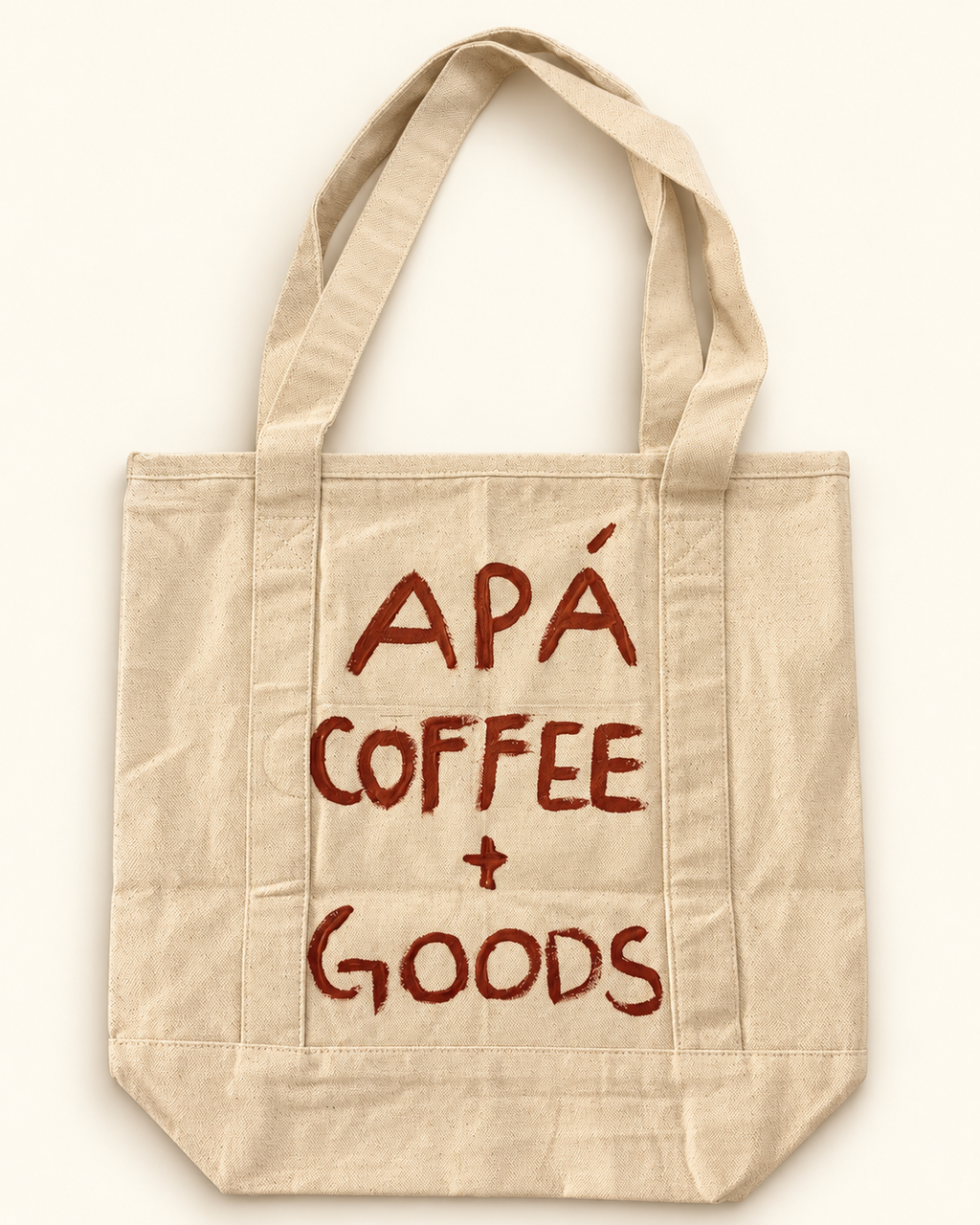 Back of the one-of-one RESERVOIR 001 hand-painted canvas tote, APÁ Coffee + Goods.