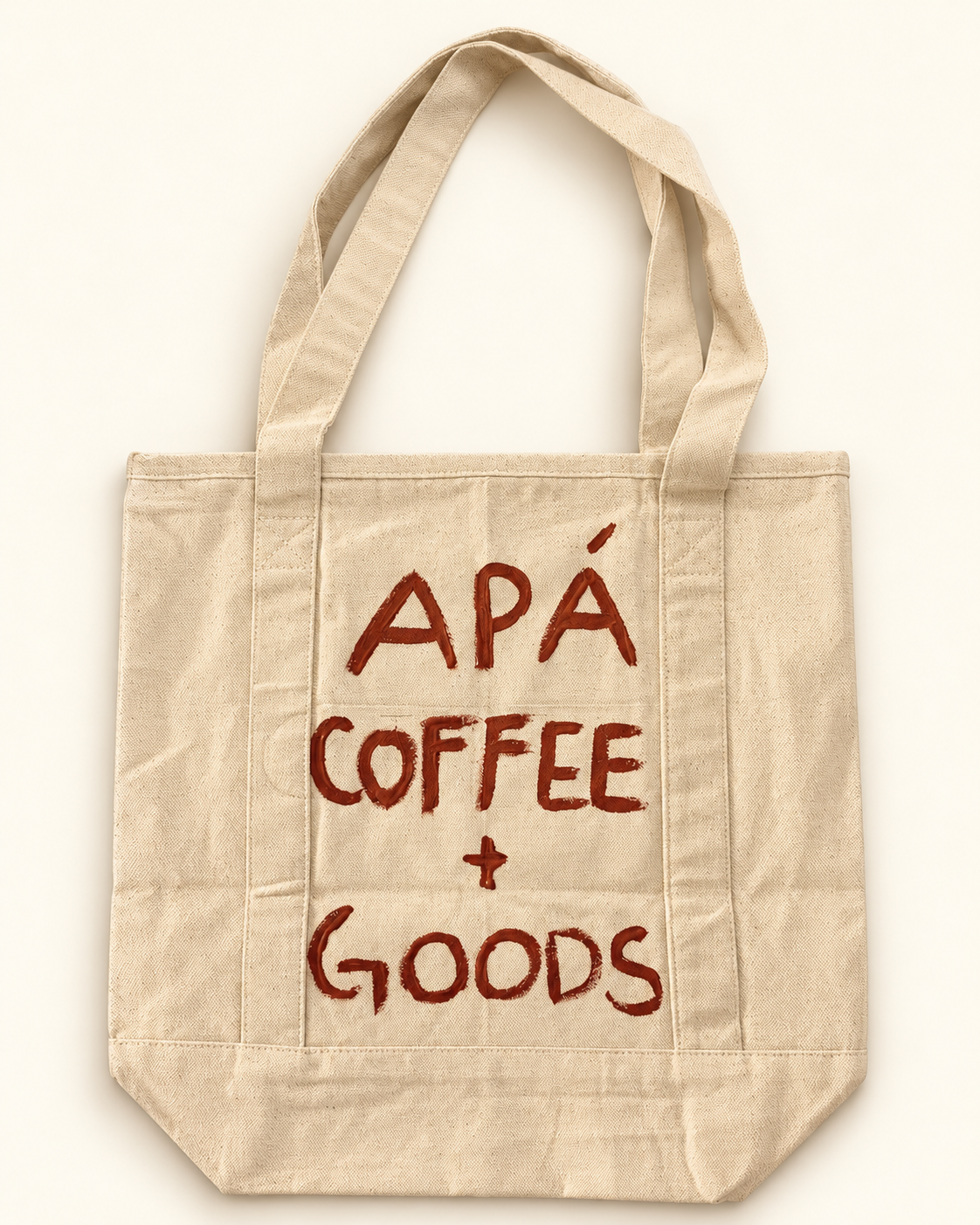 Back of the one-of-one RESERVOIR 001 hand-painted canvas tote, APÁ Coffee + Goods.